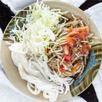 Papaya Salad · Laos style papaya, lime, tomatoes, peppers, peanuts, cabbage and noodle.

(Thai style availa...
