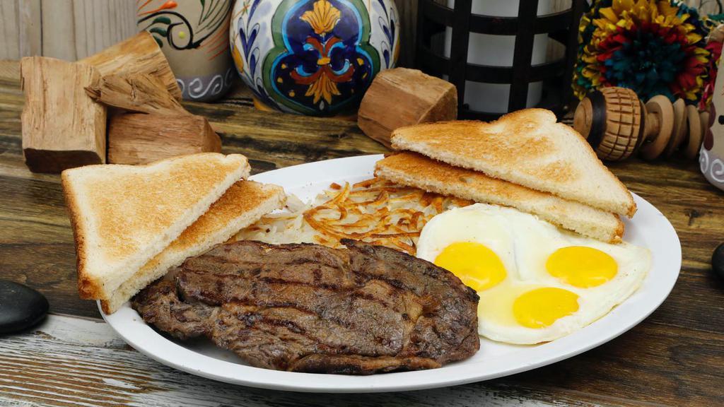 Steak & Eggs Breakfast · One piece of Rib-eye steak ,two eggs , hashbrown , two slices toast and jelly.