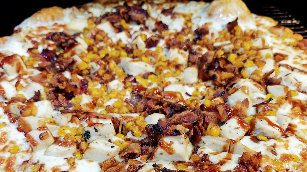 Bbq Chicken Pizza · Chicken, roasted corn, BBQ sauce, mozzarella cheese, and bacon.