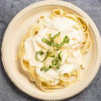 Penne Alfredo · Alfredo cream sauce served over Penne. Garnished with shaved Parmesan served with garlic bre...