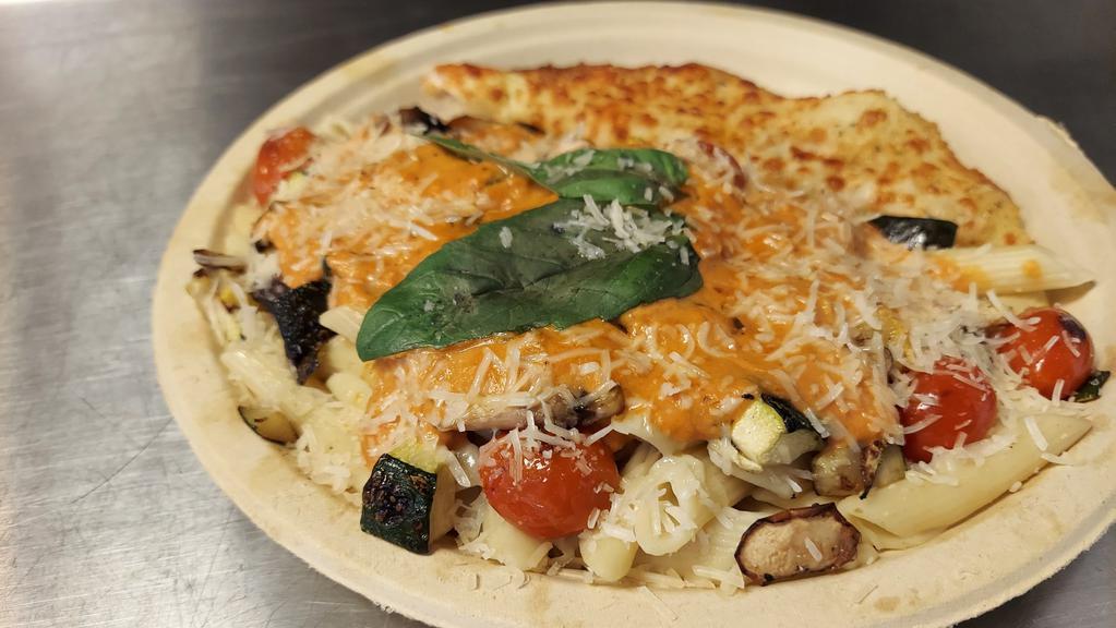 Penne Italia · Penne pasta with delicious vodka sauce, roasted vegetables, mushrooms, grape tomato, fresh basil, and grated Parmesan.