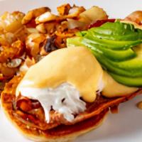 Cal Benedict · Grilled English muffin with three strips of bacon, two poached eggs, our own mornay sauce, a...
