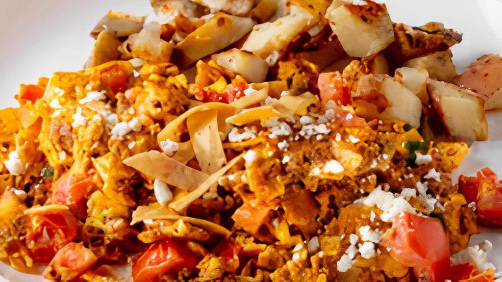 Southwest Chorizo Scramble · Three eggs scrambled with chorizo sausage, diced tomatoes, green onions, feta cheese, and crispy sabritas.  Served with your choice of side and choice of baked good.
