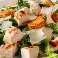 California Caesar Salad · Crisp romaine lettuce tossed with our Caesar dressing and topped with a chicken breast, shre...