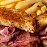 Traditional Reuben Sandwich · Corned beef, braised for hours in our kitchen, thinly sliced and served with sauerkraut, swi...