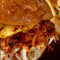 Hawaiian Pulled Pork Sandwich · Our slow-cooked pulled pork with BBQ sauce served on our Ciabatta bun with crispy coleslaw a...