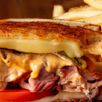 Chipotle Beef Sandwich · Served on grilled sourdough with melted cheese, Ortega chilies, tomato, chipotle mayo, and r...
