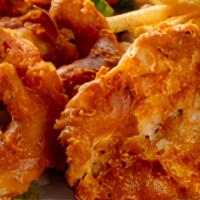 Captain'S Platter · Two pieces of haddock and three jumbo prawns in our own beer batter, fried to a perfect gold...
