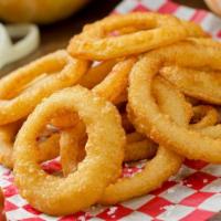 Onion Rings · Thick cut, lightly battered onion rings fried to perfection.