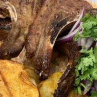 Lamb Chops (4) · Marinated succulent rack of spring lamb skewered and grilled to perfection. Served with oven...