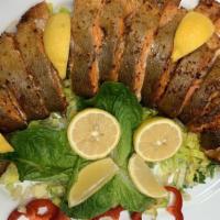 Baked Trout · Fresh trout marinated with special herbs and oven-baked. Served with potatoes or vegetables.