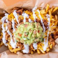 Carne Asada Fries · Carne asada, guacamole, cheddar cheese and sour cream on top of french fries.