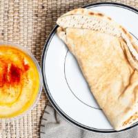 Hummus · Garbanzo bean dip with pita.