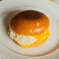 Classic Breakfast Sandwich · Toasted brioche bun with an over medium egg, American Cheese, and mayo.
