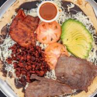 Tlayuda Mixta · Giant oaxacan tortilla spread with (asiento) Oaxacan black bean puree, Oaxacan cheese, cabba...