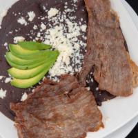 Enfrijoladas Con Tasajo ( Steak) · 5 corn tortillas dipped in Oaxacan bean puree, queso fresco, avocado side of Oaxacan white r...