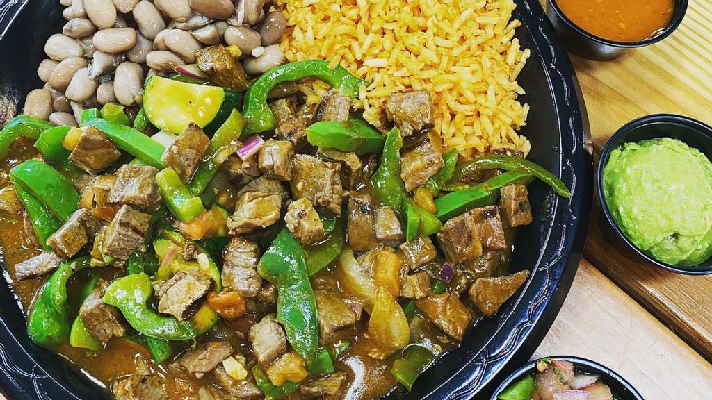 Steak Picado · Tender pieces of chopped steak, sautéed bell peppers, onions, and pico de gallo mixed in a blend of our homemade sauces.  Served with rice, beans, and your choice of corn or flour tortillas