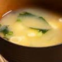 Miso Soup · Traditional miso soup with seaweed, tofu, and scallions.