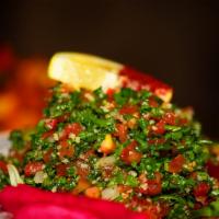 Taboulie · Chopped Italian parsley mixed with bulgur, tomato, green onion, fresh mint, freshly squeezed...