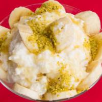 Ashta Bil Asal · An exotic house made Lebanese cream pudding, topped fresh banana, and drizzled with a touch ...