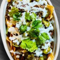 Nachos · LOADED AF - Your choice of Protein, Queso, Salsa, Beans, Garlic Crema, Grilled Jalapeños, On...