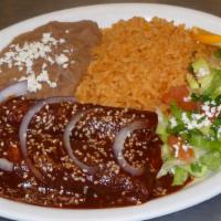 Enchiladas Poblanas · Two enchiladas chicken, shredded beef or cheese topped with mole sauce.
