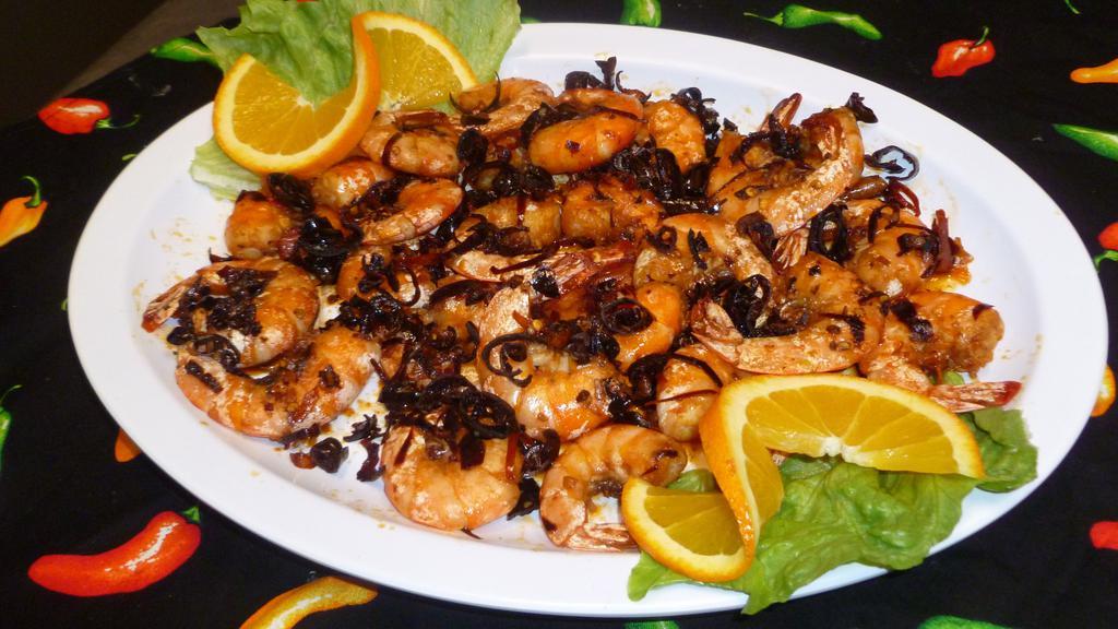Camarones Al Ajillo · Sauteed shrimp in ajillo dried peppers.