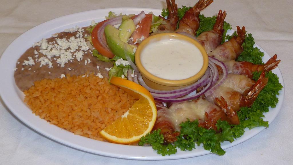 Camarones Cancun · Bacon wrapped shrimp, topped with cheese.