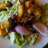 Chicken Caesar Salad · Romaine hearts, caesar dressing, garlic croutons, parmesan cheese, and lemon.