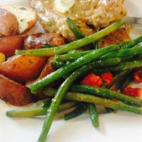 Chicken Piccata · Pan seared chicken breast, simmered in a white wine sauce with lemon and capers. Served with...