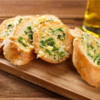 Garlic Bread · Fresh garlic bread with mozzarella cheese and served with marinara sauce on the side.