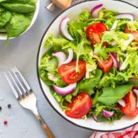 Green Salad · Salad made with fresh lettuce, tomatoes, green peppers, red onions, cucumbers, and black oli...