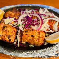 Tandoori Fish Tikka · Chunk pieces of fish marinated in exotic spices and herbs cooked in our clay oven.