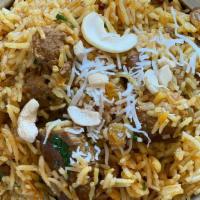 Lamb Biryani · Basmati rice cooked with pieces of lamb, spices and nuts.