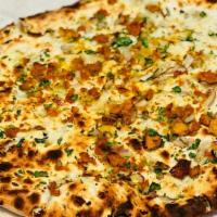 Keema Naan · Naan stuffed with delicately spiced ground lamb.