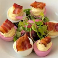 Deviled Eggs · Three pickled eggs, three regular eggs filled with mousse and topped with bacon. Served with...