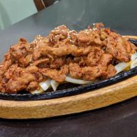 Dwae Ji Bulgogi · Sliced pork marinated in spicy sauce.