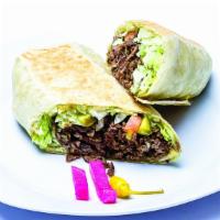 Beef Shawarma Sandwich · Served with lettuce, tomatoes, pickles, sauce, on a choice of a French roll, pita bread, or ...