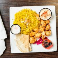 Chicken Tikka Plate · Chunks of grilled marinated chicken breast. Served with rice, pita bread, one side choice,  ...
