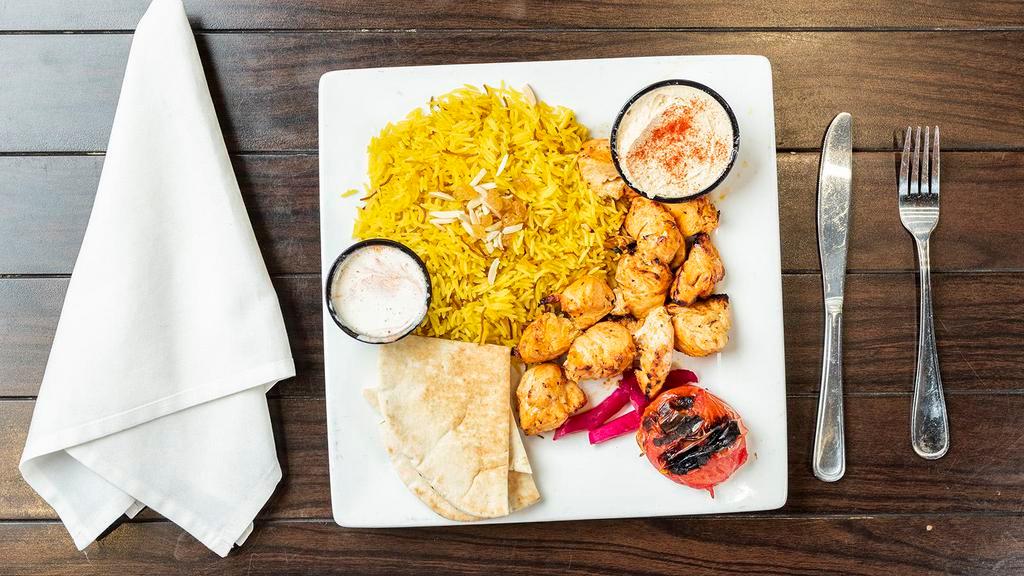 Chicken Tikka Plate · Chunks of grilled marinated chicken breast. Served with rice, pita bread, one side choice,  and one side of garlic aioli sauce.
