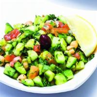 Middle Eastern Salad · Vegan or Vegetarian. Diced cucumbers, garbanzo beans, tomato, parsley, olive oil, and lemon ...