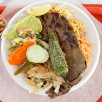 Carne Asada Plate · guacamole, pico de gallo, and lettuce. served with rice and beans