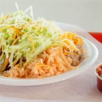 Chicken Taco · shredded chicken in spicy red sauce, lettuce, and cheese in a crunchy taco shell