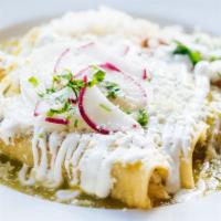 Enchiladas De Pollo · Pulled chicken, tomatillo sauce, radishes, onion, cotija cheese, crema; with steamed rice, w...