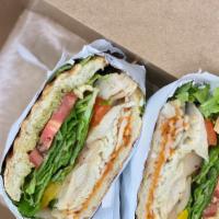 Grilled Chicken Campagnolo · Sun dried tomato & pesto aioli grilled chicken, roasted peppers & onions, lettuce, tomato, p...