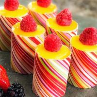 Mini Passion Fruit · A combination of passion fruit mousse and raspberry mousse layered in white sponge cake.
