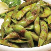 Spicy Garlic Edamame · Steamed edamame lightly salted or tossed 
with house spicy soy garlic butter.