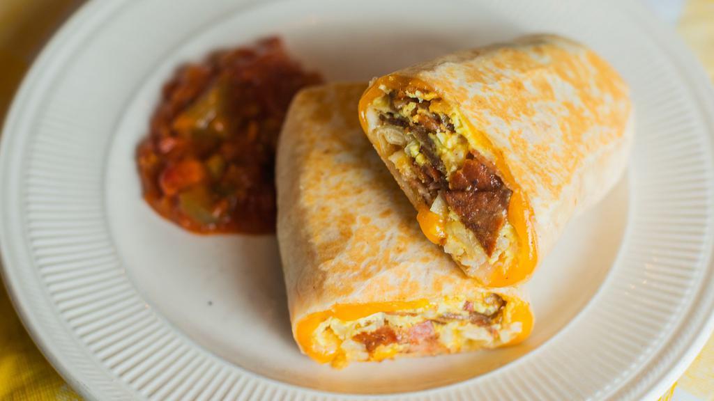 Bacon Breakfast Burrito · Flour tortilla with scrambled eggs, bacon, tater tots and melted jack and cheddar cheese with a side of salsa.