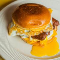 Sausage Breakfast Sandwich · Toasted brioche bun with an over medium egg, american cheese, sausage and chipotle aioli.