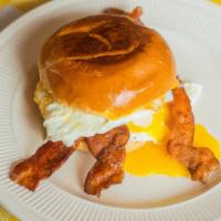 Bacon Breakfast Sandwich · Toasted brioche bun with an over medium egg, american cheese, bacon and chipotle aioli.